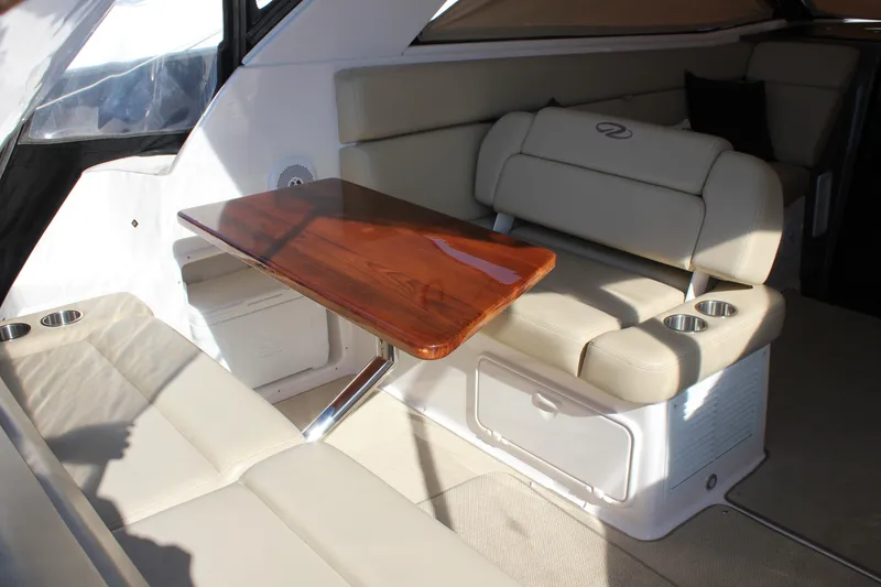 Slide: The Image of Luxurious interior of 2012 Regal 35 Sport Coupe with elegant seating and wooden table. - 20