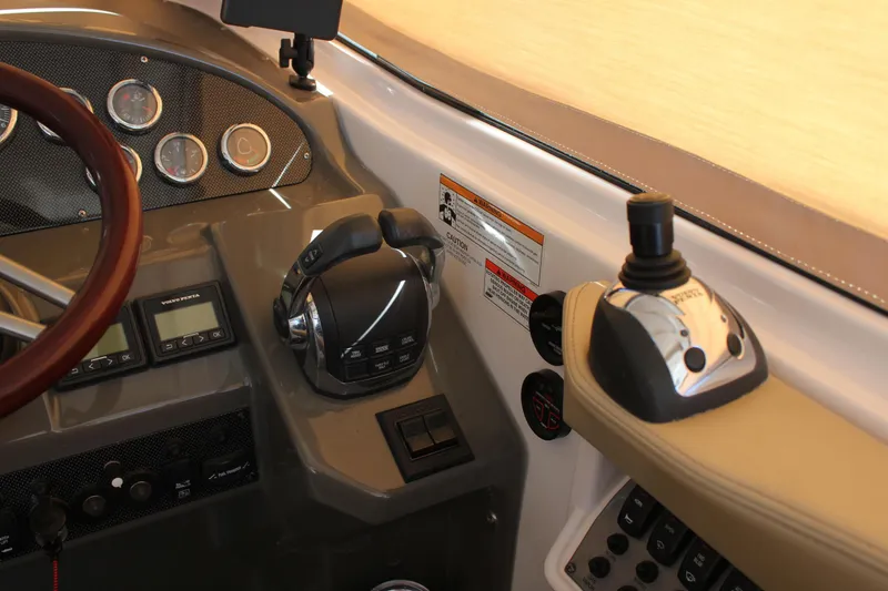 Slide: The Image of 2012 Regal 35 Sport Coupe dashboard with controls and gauges. - 24