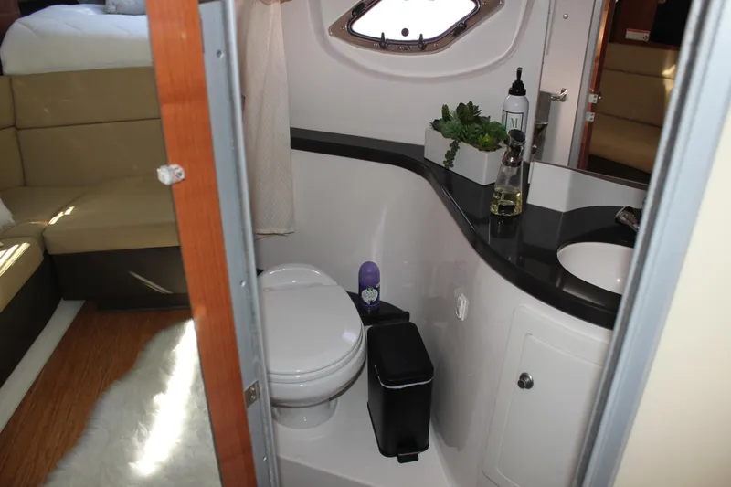 Slide: The Image of 2012 Regal 35 Sport Coupe bathroom interior with modern amenities and sleek design. - 27