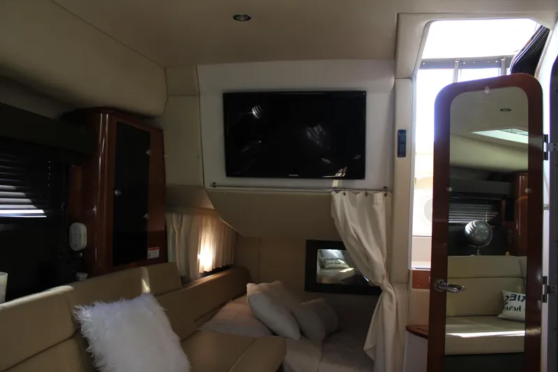 Slide: The Image of Interior of 2012 Regal 35 Sport Coupe with TV and cozy seating area. - 30