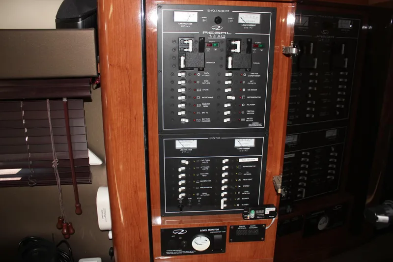 Slide: The Image of Electrical panel inside a 2012 Regal 35 Sport Coupe boat. - 33