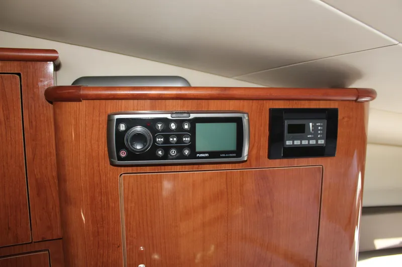 Slide: The Image of 2012 Regal 35 Sport Coupe interior control panel with wood finish. - 35