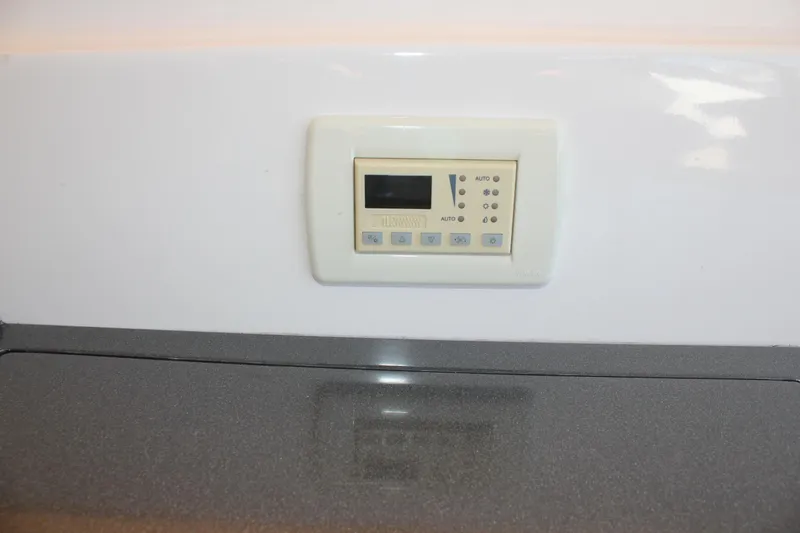 Slide: The Image of Control panel on 2012 Regal 35 Sport Coupe boat interior. - 40
