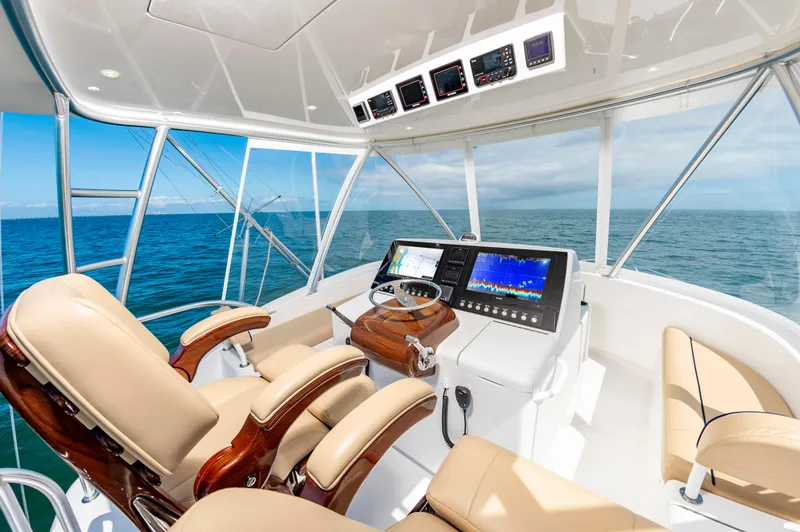 Slide: The Image of Luxurious 2023 Viking 46 yacht helm with advanced navigation systems and ocean view. - 10