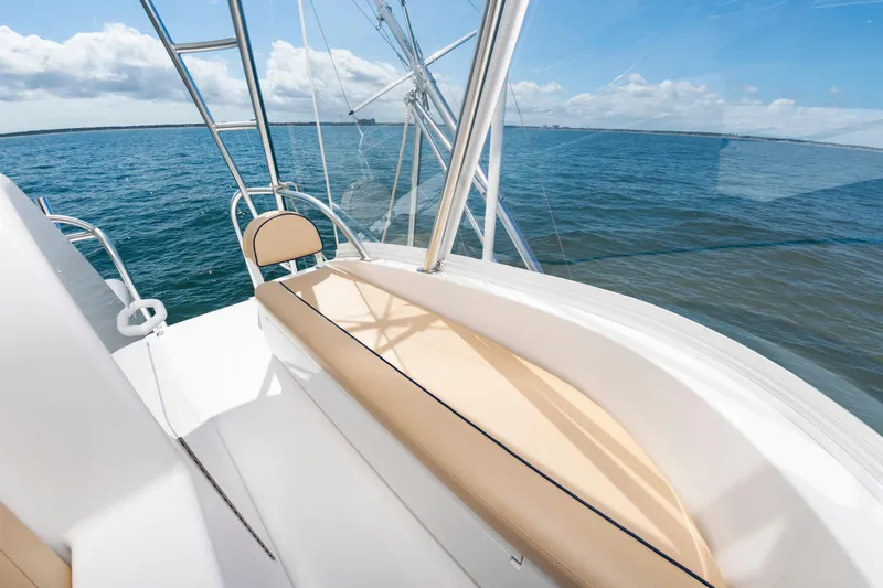 Slide: The Image of 2023 Viking 46 yacht deck with ocean view and seating. - 16