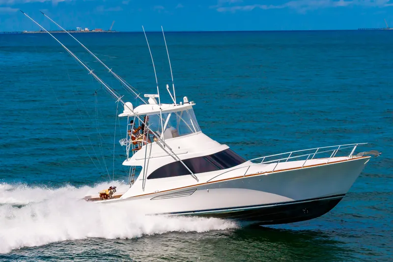 Slide: The Image of 2023 Viking 46 yacht cruising on open sea. - 2