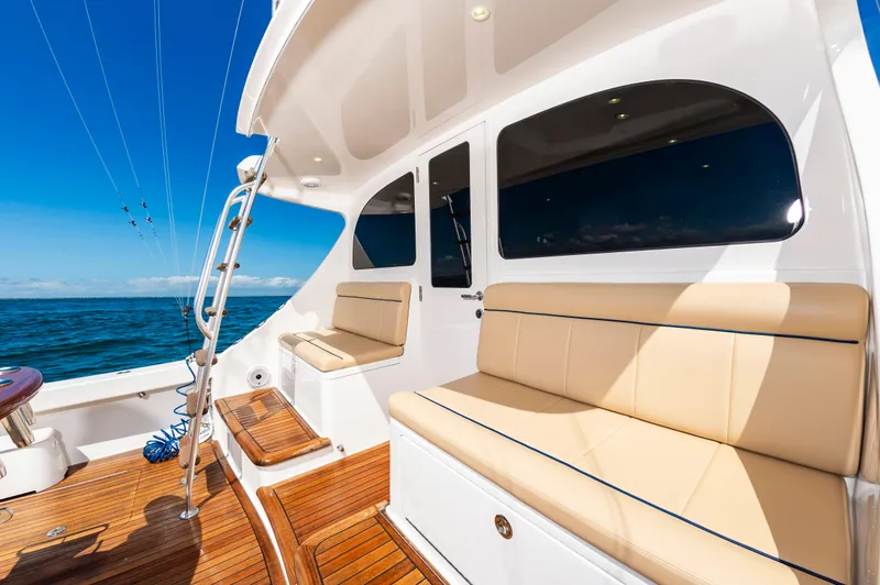 Slide: The Image of Luxurious 2023 Viking 46 yacht interior with beige seating and ocean view. - 20