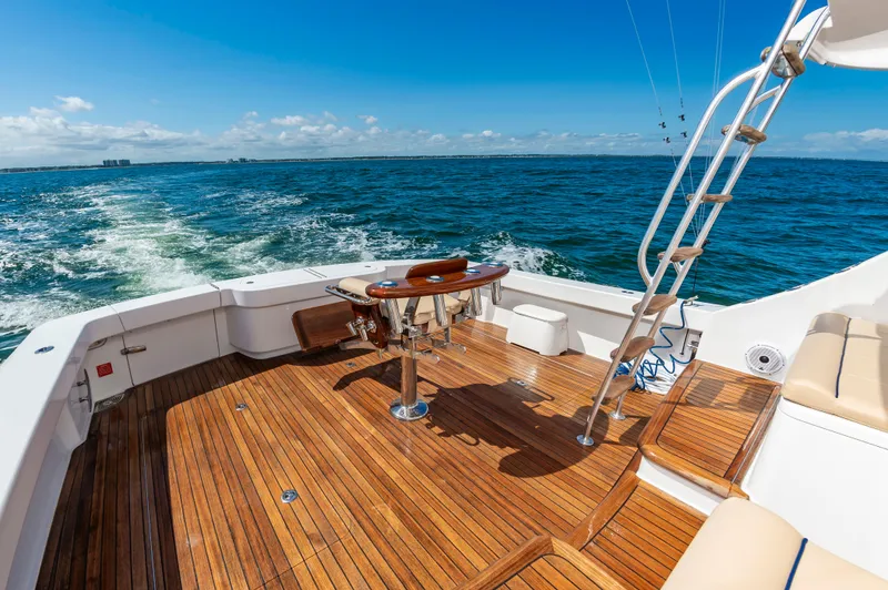 Slide: The Image of Luxurious 2023 Viking 46 yacht with teak deck cruising on open sea. - 21