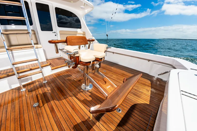 Slide: The Image of Luxurious 2023 Viking 46 yacht deck with polished wood finish and ocean view. - 22