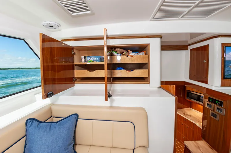 Slide: The Image of Luxurious interior of 2023 Viking 46 yacht with open cabinets and ocean view. - 28