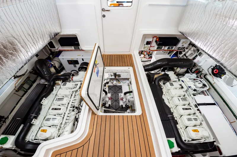 Slide: The Image of 2023 Viking 46 yacht engine room with dual engines and teak flooring. - 30