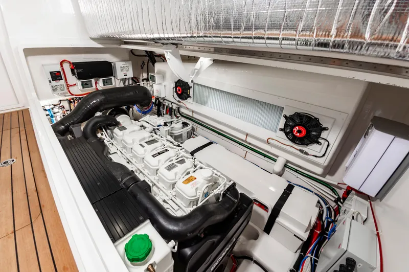 Slide: The Image of 2023 Viking 46 engine room with advanced mechanical systems and wiring. - 32