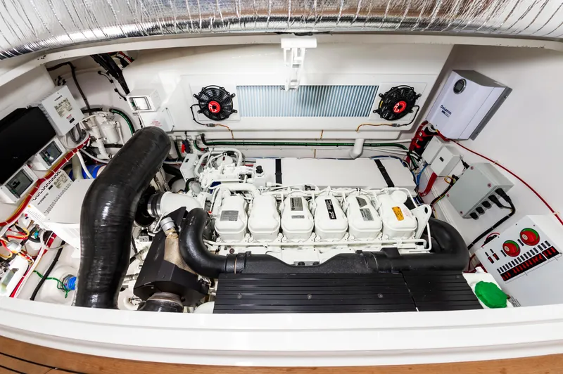 Slide: The Image of Engine room of 2023 Viking 46 yacht, showcasing advanced machinery and components. - 35
