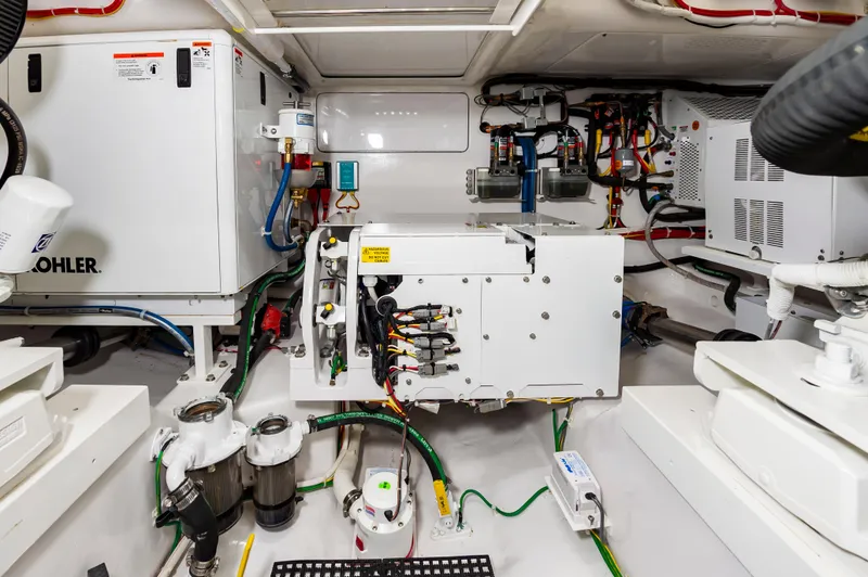Slide: The Image of Engine room of 2023 Viking 46 yacht with advanced equipment and wiring. - 36