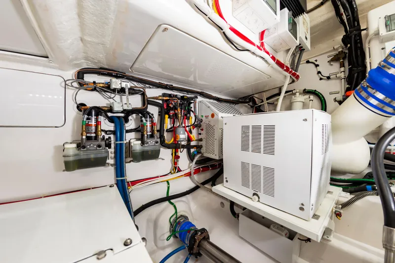 Slide: The Image of Engine room of 2023 Viking 46 yacht with complex wiring and machinery. - 37