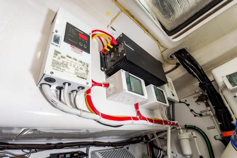 Slide: The Image of Electrical system setup in 2023 Viking 46 boat, featuring wiring and control panels. - 38