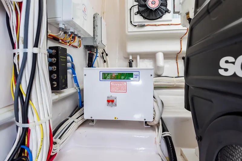 Slide: The Image of Electrical system in 2023 Viking 46 boat engine room with wiring and control panel. - 42