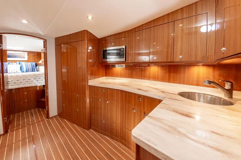 Slide: The Image of Luxurious 2023 Viking 46 yacht interior with modern kitchen and cozy bedroom. - 43