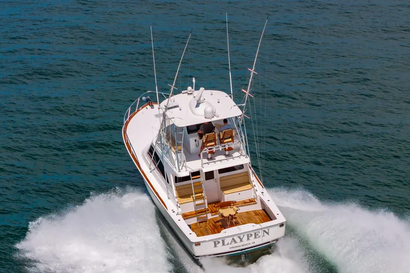 Slide: The Image of Viking 46 yacht cruising on open water, 2023 model, named "Playpen." - 5