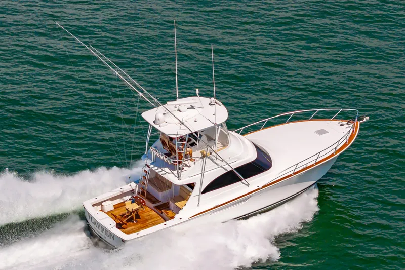 Slide: The Image of 2023 Viking 46 yacht cruising on open water, aerial view. - 7