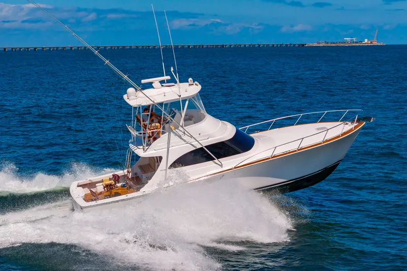 Slide: The Image of 2023 Viking 46 yacht cruising on open ocean waters. - 9