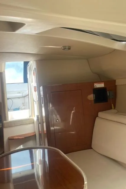 Slide: The Image of Interior of 2006 Regal 2860 Window Express boat with wood cabinetry and seating. - 22