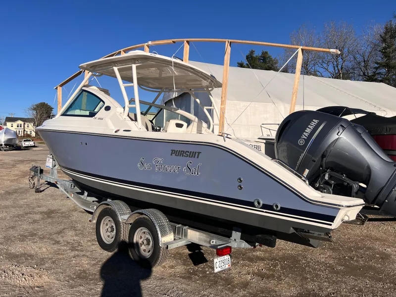 Slide: The Image of 2022 Pursuit DC 266 Dual Console boat on trailer, featuring Yamaha outboard motor. - 37