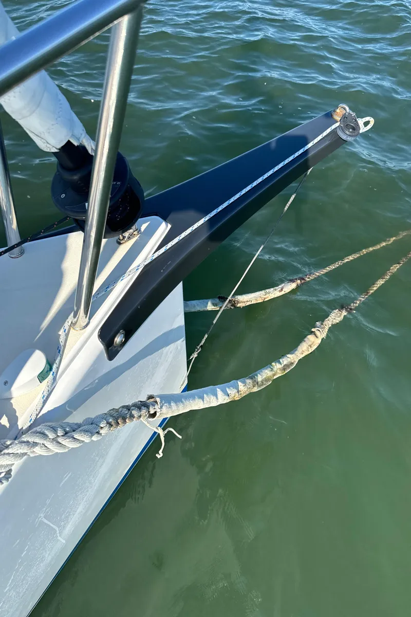 Slide: The Image of Bow of 2022 J Boats J/9 sailboat with ropes over water. - 10