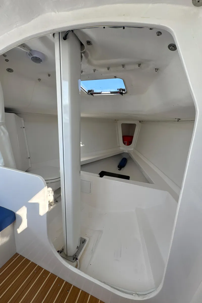 Slide: The Image of Interior view of 2022 J Boats J/9 sailboat cabin with white finish. - 15