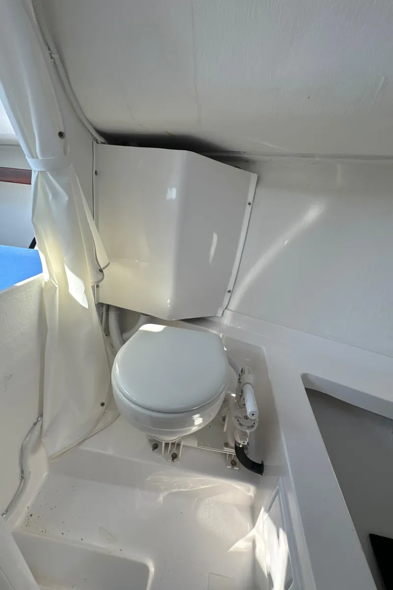 Slide: The Image of Compact marine toilet in 2022 J Boats J/9 sailboat interior. - 16