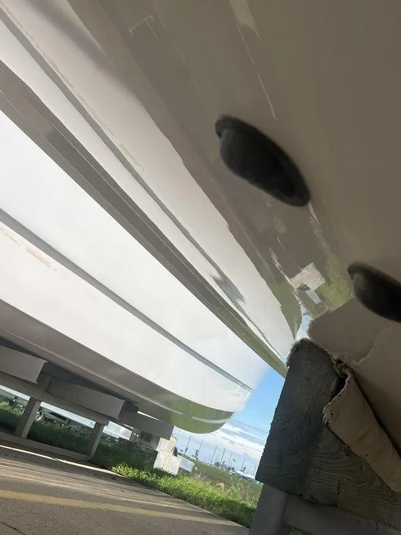 Slide: The Image of Close-up of 2021 Regulator 41 boat hull, showcasing sleek design and structure. - 12