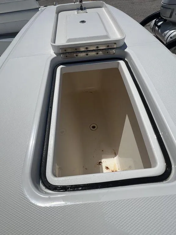 Slide: The Image of Open storage compartment on 2021 Regulator 41 boat deck. - 15