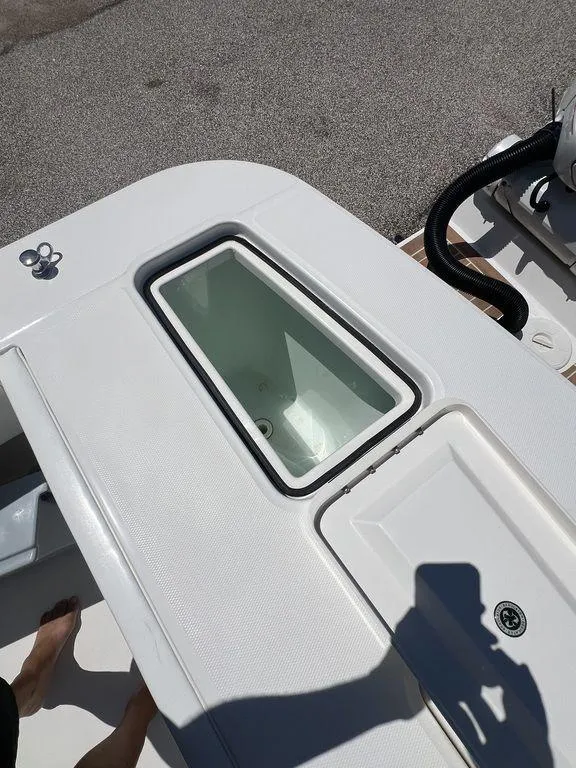 Slide: The Image of 2021 Regulator 41 boat deck with open storage compartment. - 17