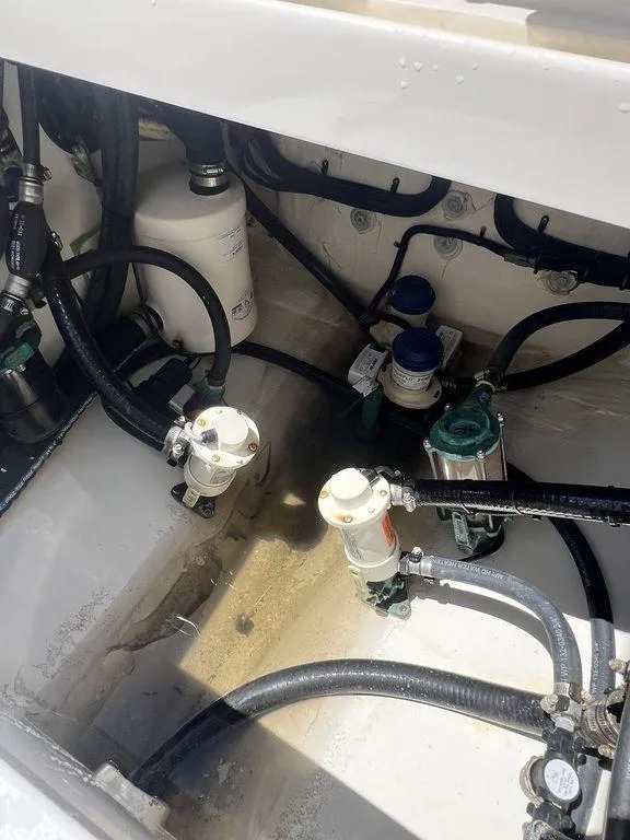 Slide: The Image of Engine compartment of 2021 Regulator 41 boat with visible hoses and filters. - 28