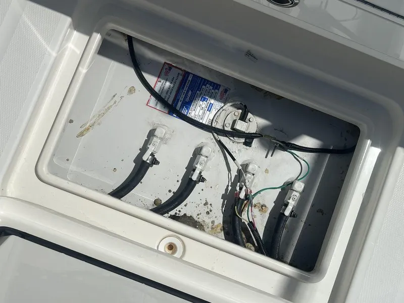 Slide: The Image of 2021 Regulator 41 boat wiring compartment with cables and connectors. - 29