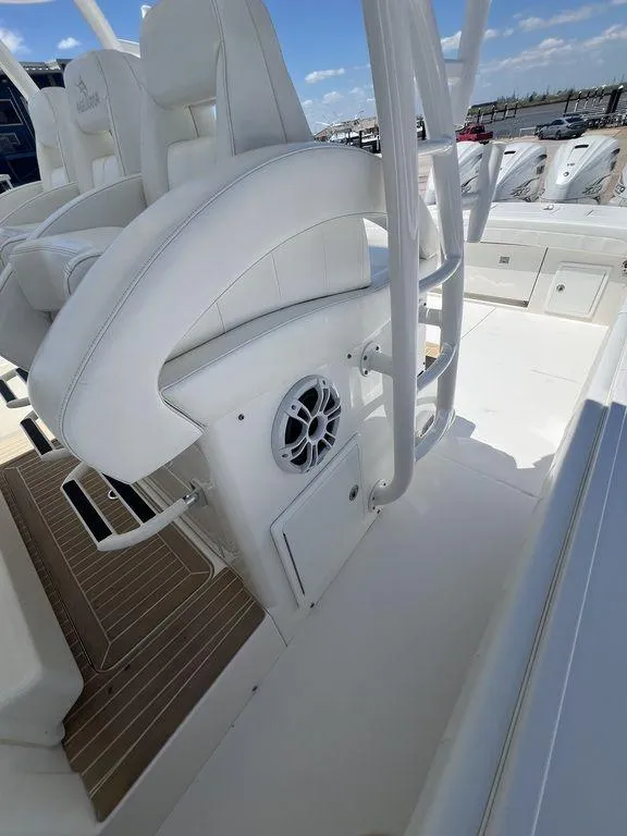 Slide: The Image of 2021 Regulator 41 boat interior with white seating and speaker system. - 30