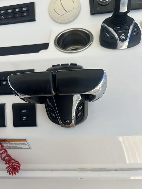 Slide: The Image of 2021 Regulator 41 boat control panel with throttle and joystick. - 41