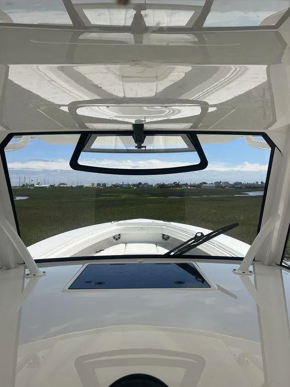Slide: The Image of 2021 Regulator 41 boat interior with windshield view and sleek design. - 43