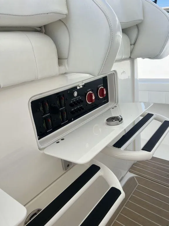 Slide: The Image of 2021 Regulator 41 boat interior with control panel and seating. - 46
