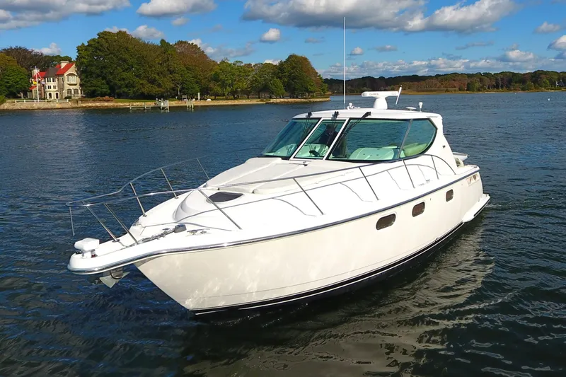 Slide: The Image of 2008 Tiara Yachts 3900 Sovran cruising on a scenic lake. - 10