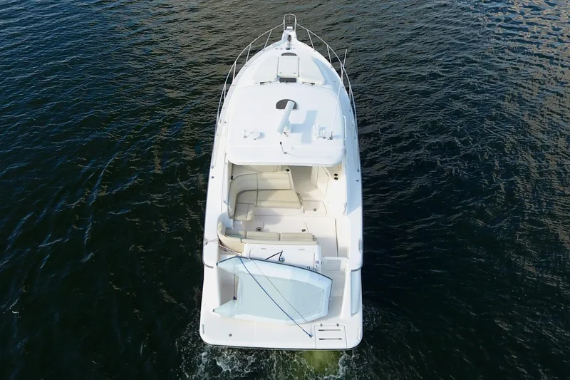 Slide: The Image of 2008 Tiara Yachts 3900 Sovran cruising on open water, aerial view. - 12
