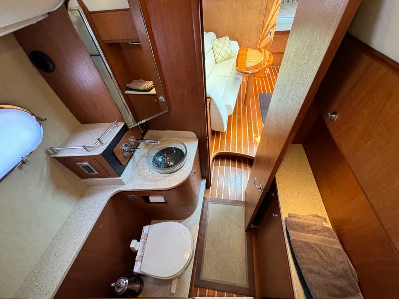 Slide: The Image of Luxurious 2008 Tiara Yachts 3900 Sovran bathroom with modern amenities and elegant wood finishes. - 48