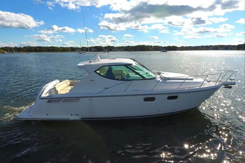 Slide: The Image of 2008 Tiara Yachts 3900 Sovran cruising on a sunny lake. - 6