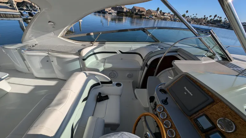 Slide: The Image of Interior of a 2007 Formula 400ss yacht with luxurious seating and sleek dashboard. - 11