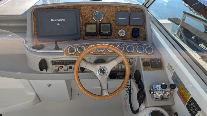 Slide: The Image of 2007 Formula 400ss boat dashboard with steering wheel and navigation controls. - 14