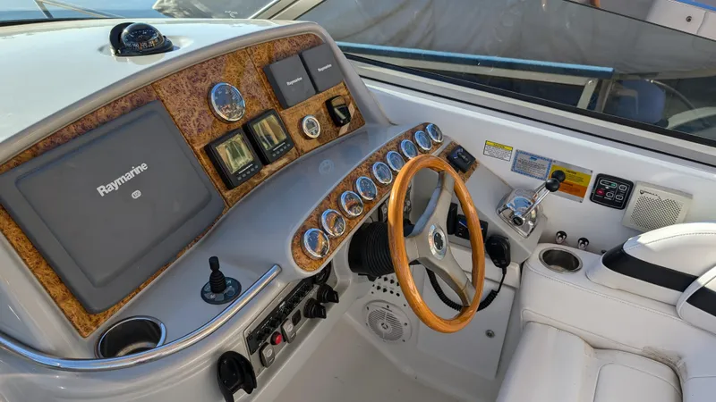 Slide: The Image of 2007 Formula 400ss boat dashboard with wood accents and Raymarine navigation system. - 15