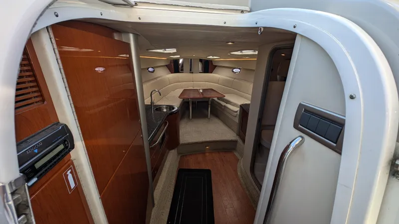 Slide: The Image of Interior of 2007 Formula 400ss boat, featuring wood paneling and seating area. - 16