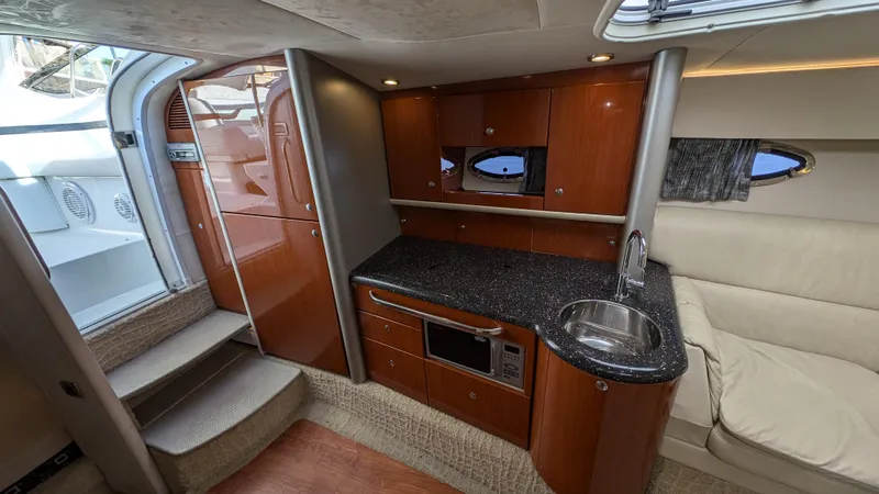 Slide: The Image of Luxurious 2007 Formula 400ss yacht interior with modern kitchen and seating area. - 17