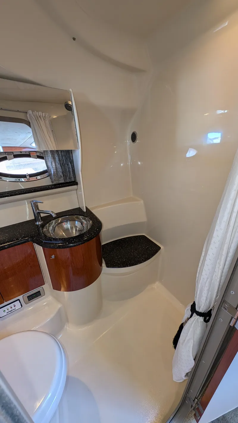 Slide: The Image of 2007 Formula 400ss yacht bathroom with sink, mirror, and shower area. - 24
