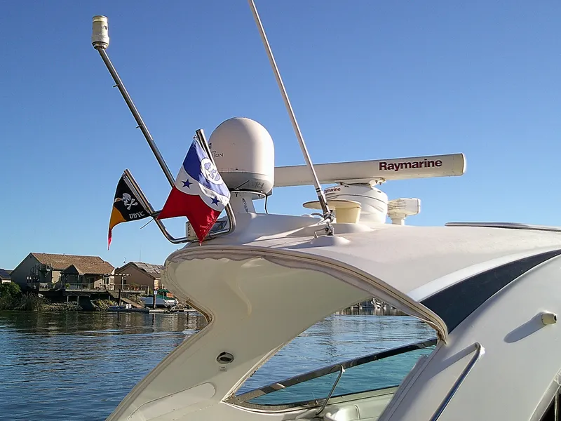 Slide: The Image of 2007 Formula 400ss boat with flags and Raymarine equipment on a sunny day. - 3